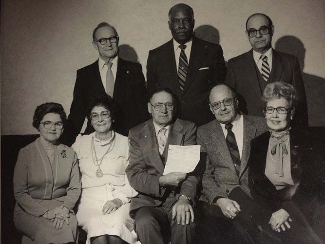 group of people in a black and white photo